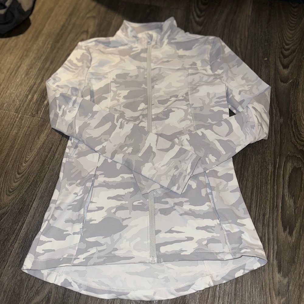 Workout jacket. Longer length. Hits hip to butt area